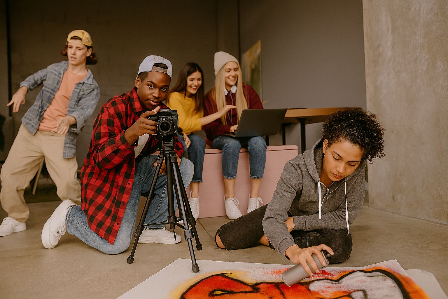 Diverse teenagers engaged in content creation, filming, and artistic activities